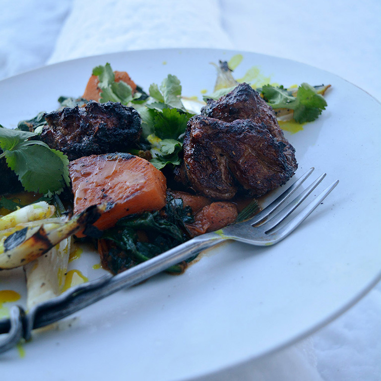 Giant border lamb kebab cooked on a snowbound fire